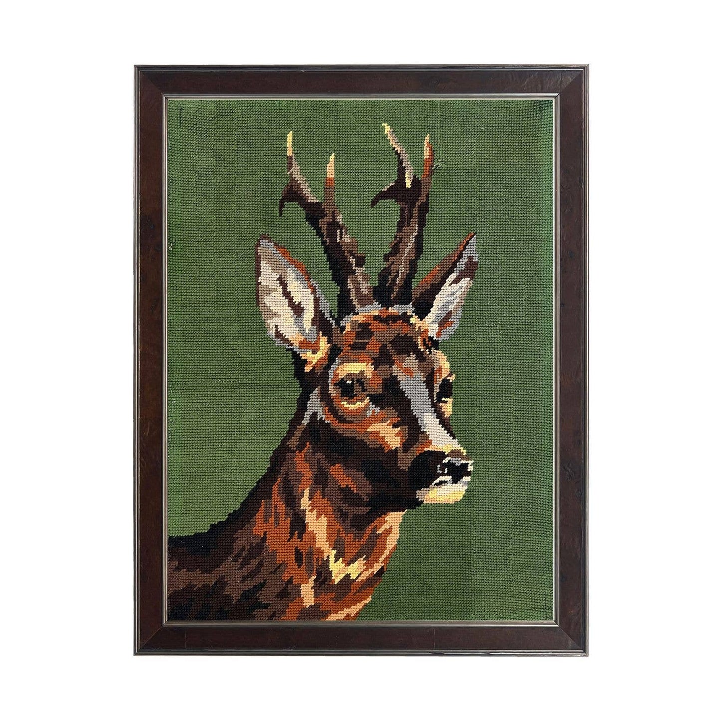 Needlework deer reproduction on a green background